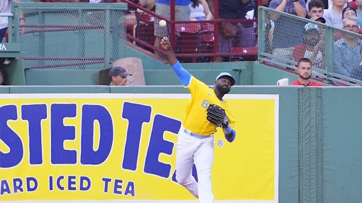 Boston Red Sox right fielder Jackie Bradley Jr. (19) throws the ball after making a catch against the Cleveland Guardians during the third inning at Fenway Park in 2022.