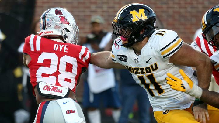 Oct 17, 2026; Oxford, Mississippi, USA; Missouri Tigers edge Langden Kitchen (11) attempts to tackle Mississippi Rebels running back Joshua Dye (28) during the fourth quarter at Vaught-Hemingway Stadium. Mandatory Credit: Petre Thomas-Imagn Images Oct 17, 2026; Oxford, Mississippi, USA; Missouri Tigers edge Langden Kitchen (11) attempts to tackle Mississippi Rebels running back Joshua Dye (28) during the fourth quarter at Vaught-Hemingway Stadium. Mandatory Credit: Petre Thomas-Imagn Images