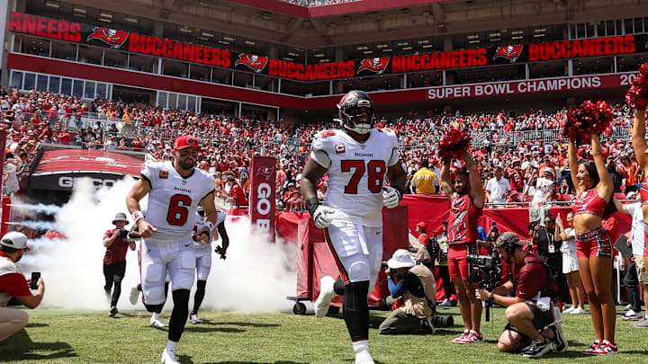 Sep 22, 2024; Tampa, Florida, USA; Tampa Bay Buccaneers quarterback Baker Mayfield (6) and offensive tackle Tristan Wirfs (78) take the field for a game against the Denver Broncos at Raymond James Stadium. Mandatory Credit: Nathan Ray Seebeck-Imagn Images