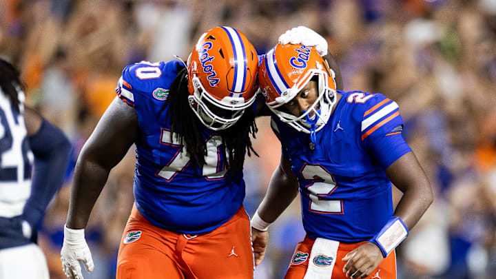 Sep 7, 2024; Gainesville, Florida, USA; Florida Gators offensive lineman Damieon George Jr. (70) and quarterback DJ Lagway (2) celebrate after a touchdown against the Samford Bulldogs during the second half at Ben Hill Griffin Stadium. Mandatory Credit: Matt Pendleton-Imagn Images