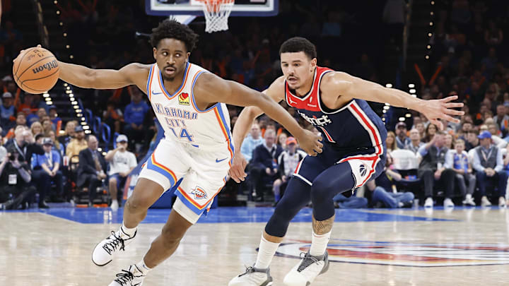 Feb 23, 2024; Oklahoma City, Oklahoma, USA; Oklahoma City Thunder forward Adam Flagler (14) moves around Washington Wizards guard Johnny Davis (1) during the second half at Paycom Center. Mandatory Credit: Alonzo Adams-Imagn Images