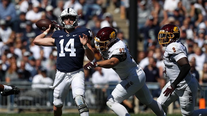 Sep 24, 2022; University Park, Pennsylvania, USA; Penn State Nittany Lions quarterback Sean Clifford (14) looks to throw a pass before being tackled by Central Michigan Chippewas defensive linesman Michael Heldman (97) during the second quarter at Beaver Stadium. Penn State defeated Central Michigan 33-14. Mandatory Credit: Matthew OHaren-Imagn Images Sep 24, 2022; University Park, Pennsylvania, USA; Penn State Nittany Lions quarterback Sean Clifford (14) looks to throw a pass before being tackled by Central Michigan Chippewas defensive linesman Michael Heldman (97) during the second quarter at Beaver Stadium. Penn State defeated Central Michigan 33-14. Mandatory Credit: Matthew OHaren-Imagn Images