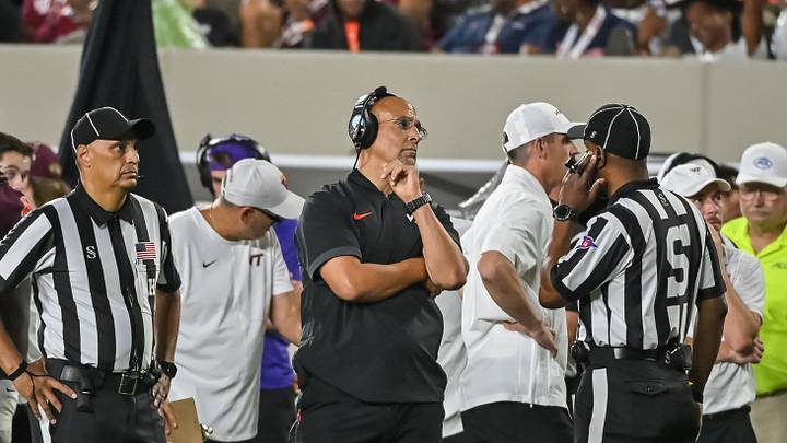 Oct 2, 2026; Blacksburg, Virginia, USA;  Virginia Tech Hokies head coach James Franklin with an official during the second quarter at Lane Stadium.  Mandatory Credit: Brian Bishop-Imagn Images