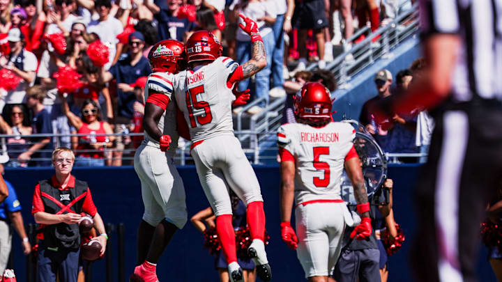 Oct 4, 2025; Tucson, Arizona, USA; Arizona Wildcats wide receiver Luke Wysong (15) celebrates after scoring a touchdown against the Oklahoma State Cowboys during the second quarter at Arizona Stadium. Mandatory Credit: Aryanna Frank-Imagn Images