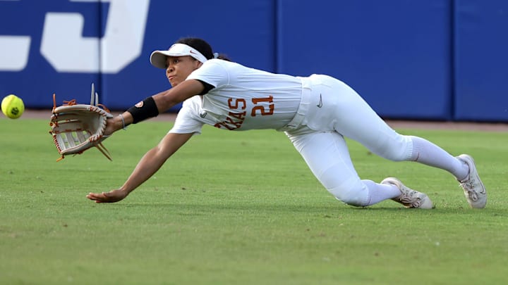 Texas outfielder Kayden Henry (21) catches the ball for an out in the third inning of a Women's College World Series semifinal softball game between the Stanford Cardinal and the Texas Longhorns at Devon Park in Oklahoma City, Monday, June 3, 2024. Texas won 1-0.