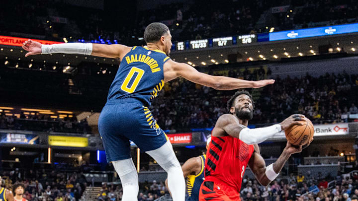 Nov 27, 2023; Indianapolis, Indiana, USA; Portland Trail Blazers center Deandre Ayton (2) shoots the ball while Indiana Pacers guard Tyrese Haliburton (0) defends in the second quarter at Gainbridge Fieldhouse. Mandatory Credit: Trevor Ruszkowski-Imagn Images Nov 27, 2023; Indianapolis, Indiana, USA; Portland Trail Blazers center Deandre Ayton (2) shoots the ball while Indiana Pacers guard Tyrese Haliburton (0) defends in the second quarter at Gainbridge Fieldhouse. Mandatory Credit: Trevor Ruszkowski-Imagn Images