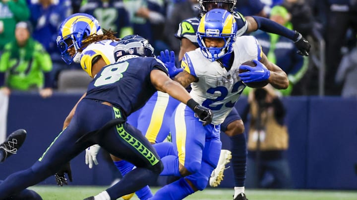 Nov 3, 2024; Seattle, Washington, USA; Los Angeles Rams running back Kyren Williams (23) rushes against the Seattle Seahawks during the fourth quarter at Lumen Field. Mandatory Credit: Joe Nicholson-Imagn Images