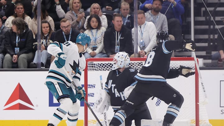 Oct 28, 2024; Salt Lake City, Utah, USA;  San Jose Sharks center Alexander Wennberg (21) scores past Utah Hockey Club goaltender Connor Ingram (39) during overtime at Delta Center. Mandatory Credit: Chris Nicoll-Imagn Images