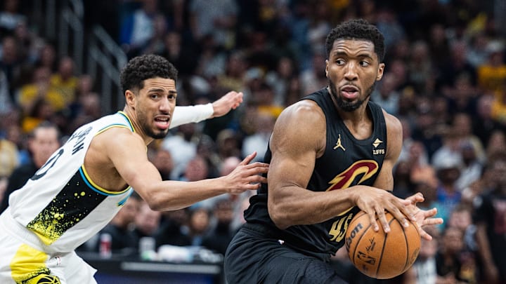 May 11, 2025; Indianapolis, Indiana, USA; Cleveland Cavaliers guard Donovan Mitchell (45) dribbles the ball while Indiana Pacers guard Tyrese Haliburton (0) defends during game four of the second round for the 2025 NBA Playoffs at Gainbridge Fieldhouse. Mandatory Credit: Trevor Ruszkowski-Imagn Images