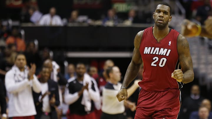Jan 15, 2014; Washington, DC, USA; Miami Heat center Greg Oden (20) runs down the court after scoring against the Washington Wizards Girls in the second quarter at Verizon Center. The Wizards won 114-97. Mandatory Credit: Geoff Burke-Imagn Images