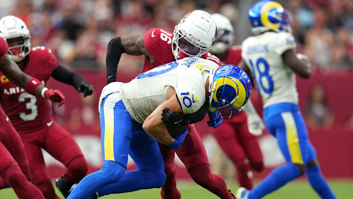 Arizona Cardinals cornerback Max Melton (16) tackles Los Angeles Rams receiver Cooper Kupp (10) at State Farm Stadium.