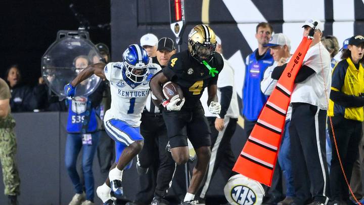 Nov 22, 2025; Nashville, Tennessee, USA; Vanderbilt Commodores cornerback Martel Hight (4) intercepts the pass thrown by Kentucky Wildcats quarterback Cutter Boley (8) during the second half at FirstBank Stadium. Mandatory Credit: Steve Roberts-Imagn Images Nov 22, 2025; Nashville, Tennessee, USA; Vanderbilt Commodores cornerback Martel Hight (4) intercepts the pass thrown by Kentucky Wildcats quarterback Cutter Boley (8) during the second half at FirstBank Stadium. Mandatory Credit: Steve Roberts-Imagn Images