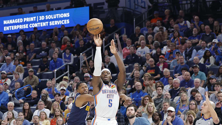 Mar 10, 2025; Oklahoma City, Oklahoma, USA;Oklahoma City Thunder guard Luguentz Dort (5) shoots against the Denver Nuggets during the second half at Paycom Center. Mandatory Credit: Alonzo Adams-Imagn Images