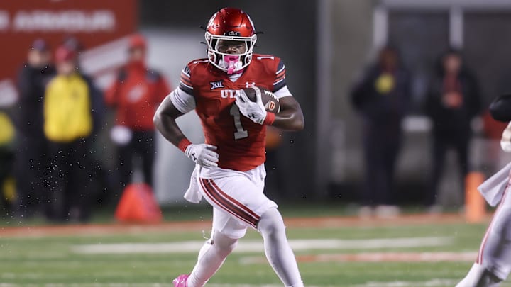 Utah Utes running back Wayshawn Parker (1) run the ball against the Arizona State Sun Devils during the first quarter at Rice-Eccles Stadium.