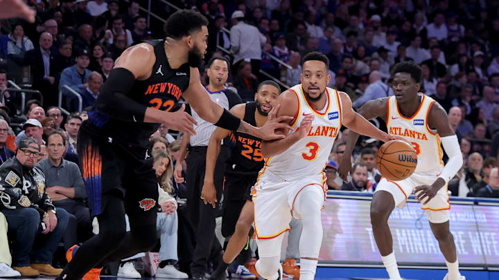 Apr 20, 2026; New York, New York, USA; Atlanta Hawks guard CJ McCollum (3) controls the ball against New York Knicks center Karl-Anthony Towns (32) during the third quarter of game two of the first round of the 2026 NBA Playoffs at Madison Square Garden. Mandatory Credit: Brad Penner-Imagn Images