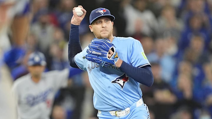 Apr 8, 2026; Toronto, Ontario, CAN; Toronto Blue Jays pitcher Jeff Hoffman (23) throws to first base to get out Los Angeles Dodgers third baseman Max Muncy (not pictured)during the ninth inning at Rogers Centre. Mandatory Credit: John E. Sokolowski-Imagn Images