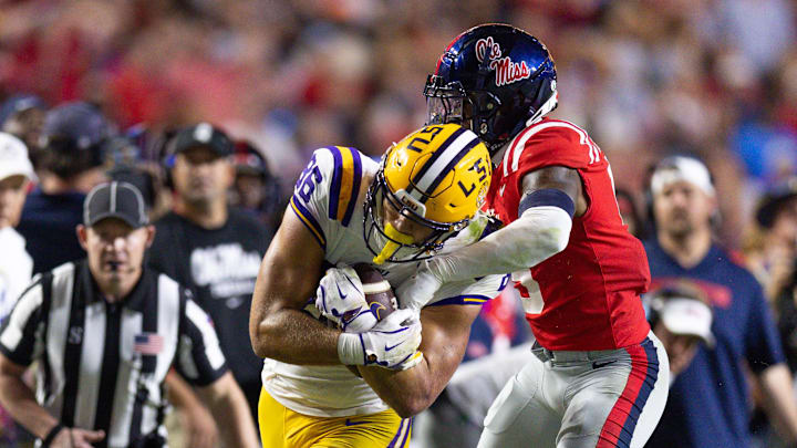 LSU Tigers tight end Mason Taylor makes a first down against Mississippi Rebels cornerback Trey Amos.