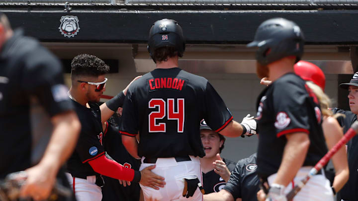 Georgia's Charlie Condon (24) celebrates with his teammates after scoring another run during a NCAA Athens Regional baseball game against Army in Athens, Ga., on Friday, May 31, 2024. Georgia won 8-7.