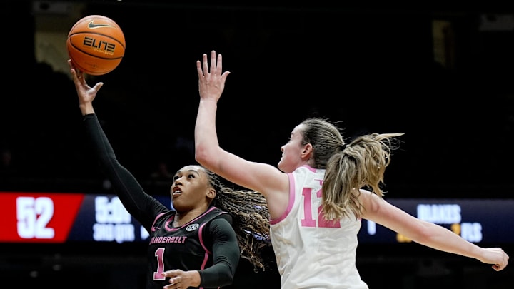 Vanderbilt guard Mikayla Blakes goes to the basket against Oklahoma guard Payton Verhulst (12) during the second half of an NCAA college basketball game at Memorial Gymnasium Monday, Feb. 9, 2026, in Nashville, Tenn. Vanderbilt won 102-86.