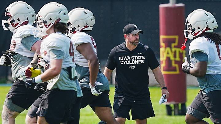 Iowa State football head coach Jimmy Rogers watches the defense warm up during the university’s football open practice at Johnny Majors practice field on August 8, 2026, in Ames, Iowa. Iowa State football head coach Jimmy Rogers watches the defense warm up during the university’s football open practice at Johnny Majors practice field on August 8, 2026, in Ames, Iowa.