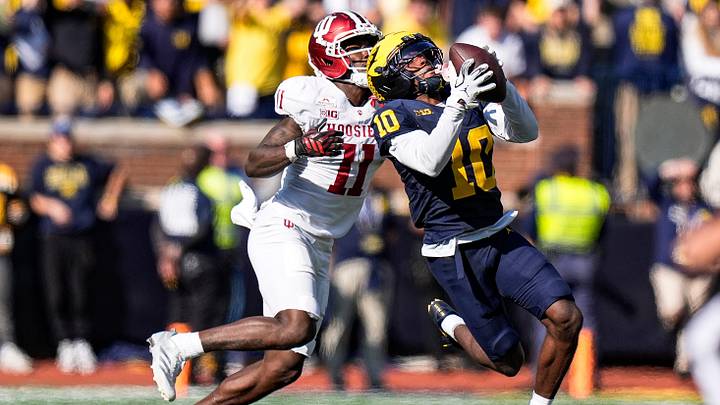 Michigan cornerback Zeke Berry (10) intercepts a pass intended for Indiana wide receiver Nick Marsh (11) during the second half at Michigan Stadium in Ann Arbor on Saturday, Oct. 24, 2026. Michigan cornerback Zeke Berry (10) intercepts a pass intended for Indiana wide receiver Nick Marsh (11) during the second half at Michigan Stadium in Ann Arbor on Saturday, Oct. 24, 2026.