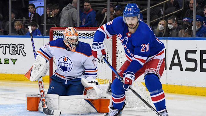 Dec 22, 2023; New York, New York, USA;  New York Rangers left wing Chris Kreider (20) plays the puck in front of Edmonton Oilers goaltender Stuart Skinner (74) during the second period at Madison Square Garden. Mandatory Credit: Dennis Schneidler-Imagn Images