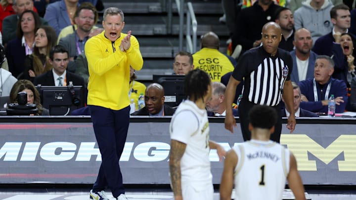Apr 6, 2026; Indianapolis, IN, USA; Michigan Wolverines head coach Dusty May celebrates after a play against the UConn Huskies in the second half during the national championship of the Final Four of the men's 2026 NCAA Tournament at Lucas Oil Stadium. Mandatory Credit: Trevor Ruszkowski-Imagn Images