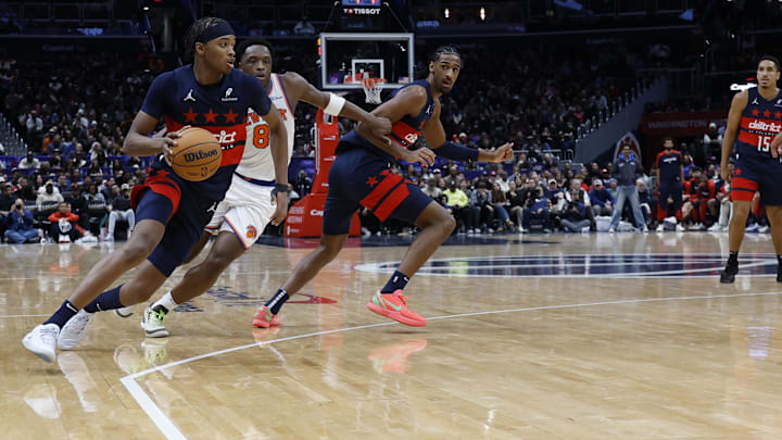Dec 28, 2024; Washington, District of Columbia, USA; Washington Wizards guard Bilal Coulibaly (0) drives to the basket past New York Knicks forward OG Anunoby (8) in the fourth quarter at Capital One Arena. Mandatory Credit: Geoff Burke-Imagn Images