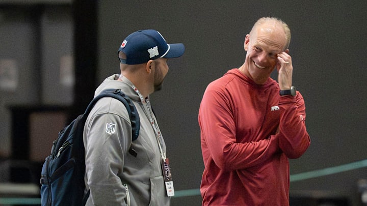 March 25, 2026; Tuscaloosa, AL, USA; Alabama head coach Kalen DeBoer talks to an NFL scourt during Pro Day in the Hank Crisp Indoor Practice Facility at the University of Alabama.