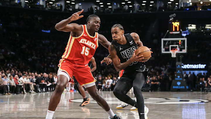 Feb 29, 2024; Brooklyn, New York, USA;  Brooklyn Nets center Nic Claxton (33) moves the ball against Atlanta Hawks center Clint Capela (15) in the second quarter at Barclays Center. Mandatory Credit: Wendell Cruz-Imagn Images