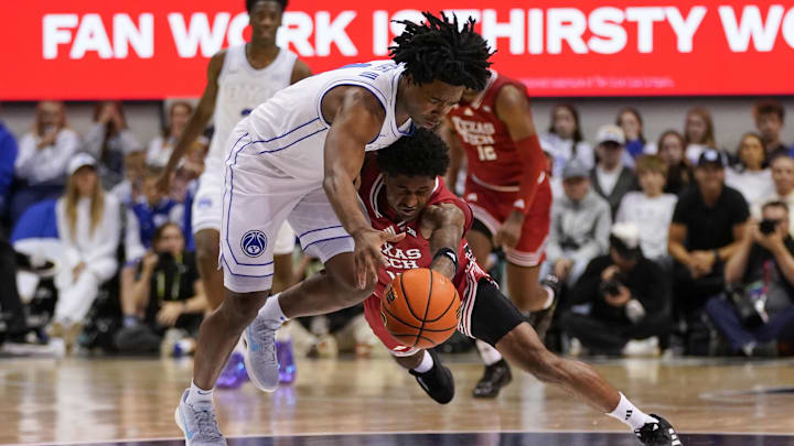 Mar 7, 2026; Provo, Utah, USA; Texas Tech Red Raiders guard Jaylen Petty (11) and BYU Cougars guard Robert Wright III (1) dive after a loose ball during the second half at Marriott Center. Mandatory Credit: Aaron Baker-Imagn Images Mar 7, 2026; Provo, Utah, USA; Texas Tech Red Raiders guard Jaylen Petty (11) and BYU Cougars guard Robert Wright III (1) dive after a loose ball during the second half at Marriott Center. Mandatory Credit: Aaron Baker-Imagn Images
