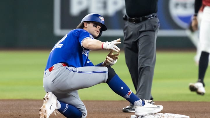 Apr 19, 2026; Phoenix, Arizona, USA; Toronto Blue Jays second baseman Ernie Clement reacts after hitting a first inning double against the Arizona Diamondbacks at Chase Field. 