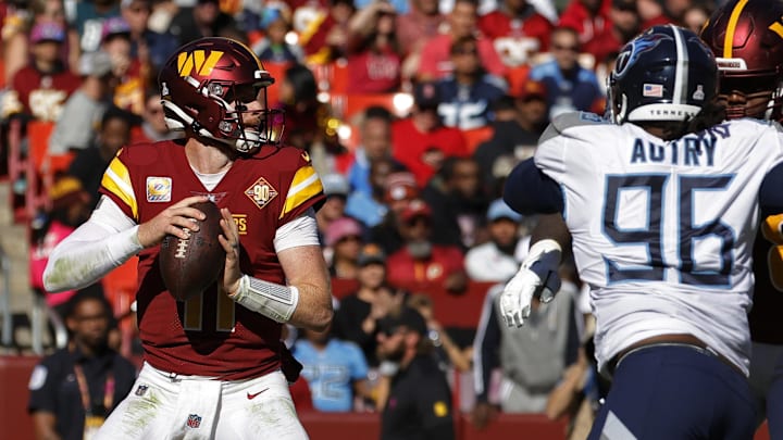 Oct 9, 2022; Landover, Maryland, USA; Washington Commanders quarterback Carson Wentz (11) prepares