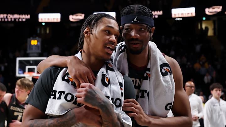 Feb 7, 2026; Nashville, Tennessee, USA;  Oklahoma Sooners forward Tae Davis (13) and forward Mohamed Wague (5) celebrate the win against the Vanderbilt Commodores during the second half at Memorial Gymnasium. Mandatory Credit: Steve Roberts-Imagn Images