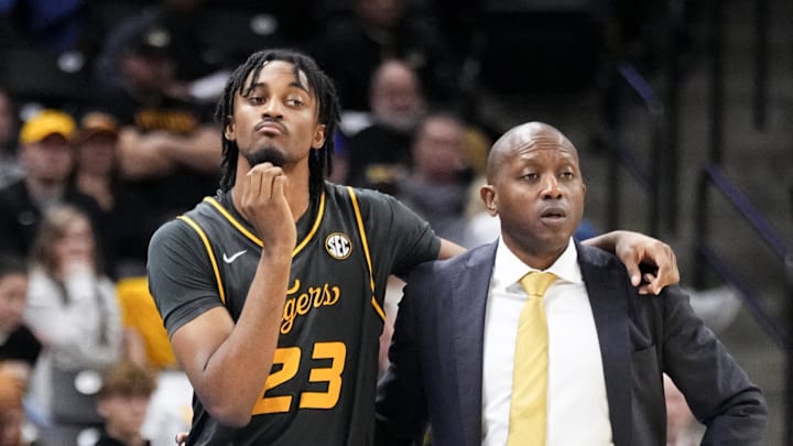 Dec 14, 2024; Columbia, Missouri, USA; Missouri Tigers guard Aidan Shaw (23) stands with head coach Dennis Gates while waiting to go in against the LIU Sharks during the second half at Mizzou Arena. Mandatory Credit: Denny Medley-Imagn Images