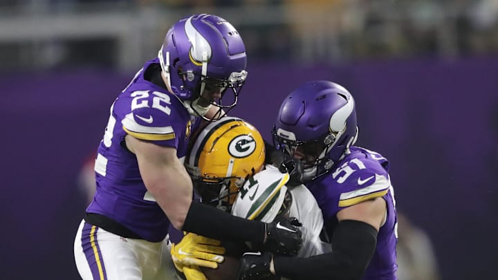 Dec 29, 2024; Minneapolis, Minnesota, USA; Green Bay Packers wide receiver Jayden Reed (11) is stopped by Minnesota Vikings safety Harrison Smith (22) and linebacker Blake Cashman (51) during their football game at U.S. Bank Stadium. Mandatory Credit: Dan Powers/USA TODAY NETWORK-Wisconsin via Imagn Images Dec 29, 2024; Minneapolis, Minnesota, USA; Green Bay Packers wide receiver Jayden Reed (11) is stopped by Minnesota Vikings safety Harrison Smith (22) and linebacker Blake Cashman (51) during their football game at U.S. Bank Stadium. Mandatory Credit: Dan Powers/USA TODAY NETWORK-Wisconsin via Imagn Images