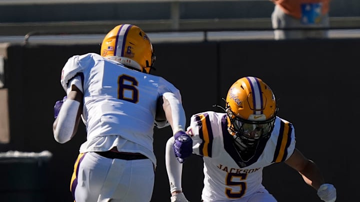 Dec 6, 2024; Birmingham, AL, USA; Jackson's Keeyun Chapman (6) and Jackson's Chris Payne (5) celebrate a touchdown by Payne against Cherokee County at Protective Stadium in the AHSAA 4A State Championship game.