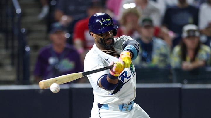 Sep 20, 2025; Tampa, Florida, USA; Tampa Bay Rays first baseman Yandy Diaz (2) hits an rbi single against the Boston Red Sox in the seventh inning at George M. Steinbrenner Field. Sep 20, 2025; Tampa, Florida, USA; Tampa Bay Rays first baseman Yandy Diaz (2) hits an rbi single against the Boston Red Sox in the seventh inning at George M. Steinbrenner Field.