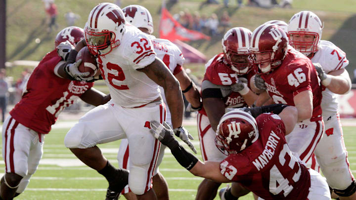 10: John Clay played from 2008 through 2010, rushing for 3,413 yards. Clay is shown breaking through the Indiana defense on a 14-yard touchdown run during the second quarter of their game on November 7, 2009, at Memorial Stadium in Bloomington, Indiana. Wisconsin won 31-28.