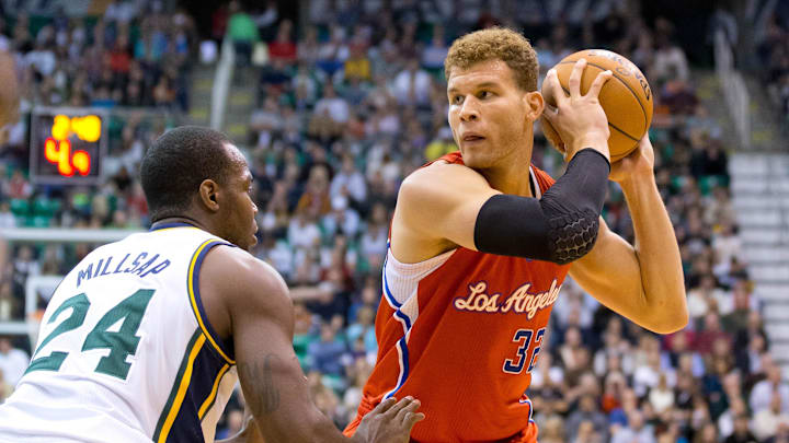 Los Angeles Clippers power forward Blake Griffin (32) controls the ball while defended by Utah Jazz power forward Paul Millsap (24) during the first half at EnergySolutions Arena. 