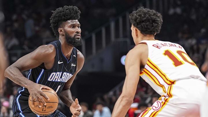 Apr 13, 2025; Atlanta, Georgia, USA; Orlando Magic forward Jonathan Isaac (1) handles the ball guarded by Atlanta Hawks forward Zaccharie Risacher (10) during the first half at State Farm Arena. Mandatory Credit: Dale Zanine-Imagn Images