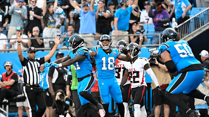 Oct 13, 2024; Charlotte, North Carolina, USA; Carolina Panthers wide receiver Xavier Legette (17) celebrates with wide receiver Jalen Coker (18) after scoring a touchdown in the second quarter at Bank of America Stadium. 