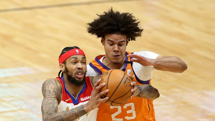 Feb 19, 2021; New Orleans, Louisiana, USA; New Orleans Pelicans forward Brandon Ingram (14) is defended by Phoenix Suns forward Cameron Johnson (23) in the second quarter at the Smoothie King Center. Mandatory Credit: Chuck Cook-Imagn Images Feb 19, 2021; New Orleans, Louisiana, USA; New Orleans Pelicans forward Brandon Ingram (14) is defended by Phoenix Suns forward Cameron Johnson (23) in the second quarter at the Smoothie King Center. Mandatory Credit: Chuck Cook-Imagn Images