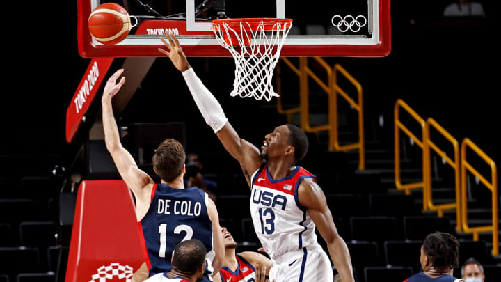 Aug 7, 2021; Saitama, Japan; France shooting guard Nando de Colo (12) shoots the ball against United States center Bam Adebayo (13) in the men's basketball gold medal game during the Tokyo 2020 Olympic Summer Games at Saitama Super Arena. Mandatory Credit: Geoff Burke-USA TODAY Sports Aug 7, 2021; Saitama, Japan; France shooting guard Nando de Colo (12) shoots the ball against United States center Bam Adebayo (13) in the men's basketball gold medal game during the Tokyo 2020 Olympic Summer Games at Saitama Super Arena. Mandatory Credit: Geoff Burke-USA TODAY Sports