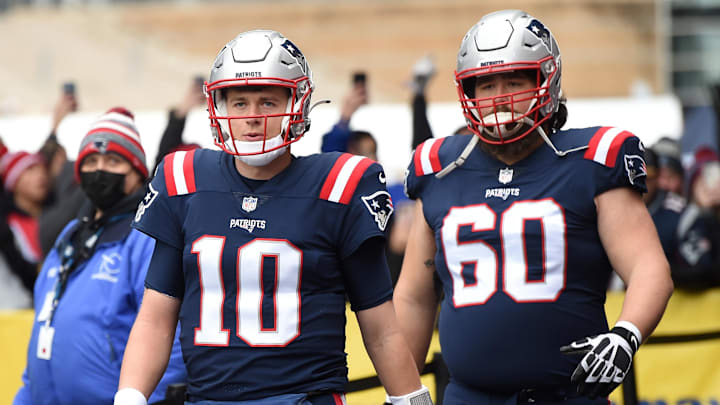 Dec 26, 2021; Foxborough, Massachusetts, USA;  New England Patriots quarterback Mac Jones (10) and