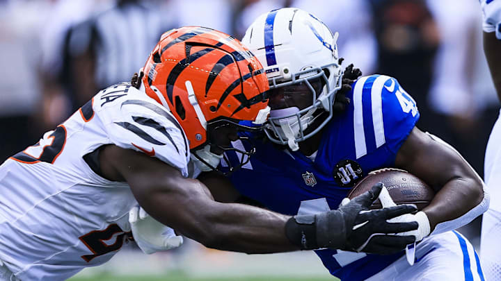 Aug 23, 2025; Cincinnati, Ohio, USA; Indianapolis Colts running back Nate Noel (41) runs with the ball against Cincinnati Bengals linebacker Maema Njongmeta (45) in the second half at Paycor Stadium. Mandatory Credit: Katie Stratman-Imagn Images
