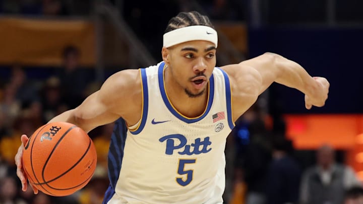 Feb 25, 2025; Pittsburgh, Pennsylvania, USA;  Pittsburgh Panthers guard Ishmael Leggett (5) dribbles against the Georgia Tech Yellow Jackets during the first half at the Petersen Events Center. Mandatory Credit: Charles LeClaire-Imagn Images