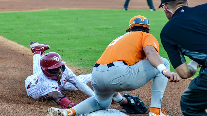 Oklahoma outfielder Dasan Harris slides into third base against Tennessee. Oklahoma outfielder Dasan Harris slides into third base against Tennessee.