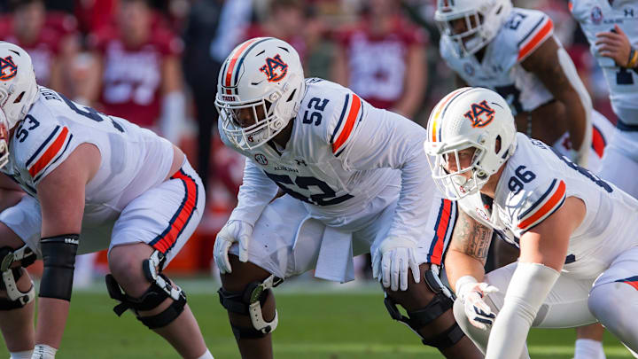 Nov 11, 2023; Fayetteville, Arkansas, USA;  Auburn Tigers defensive lineman Justin Rogers (52) gets