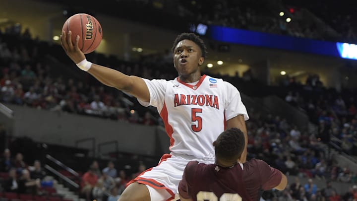 Mar 19, 2015; Portland, OR, USA; Arizona Wildcats forward Stanley Johnson (5) shoots the basketball against Texas Southern Tigers forward Jason Carter (23) during the first half in the second round of the 2015 NCAA Tournament at Moda Center. Mandatory Credit: Kirby Lee-Imagn Images